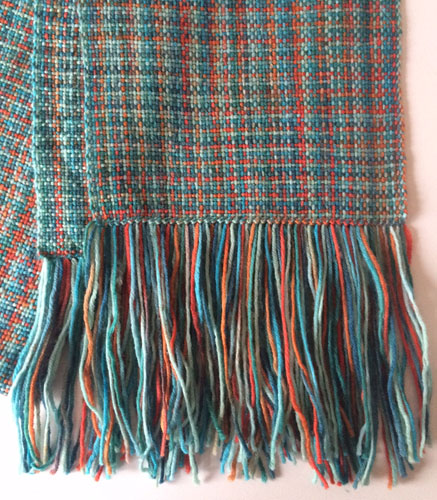 Variegated hem stitching on the plain weave rigid heddle woven scarf