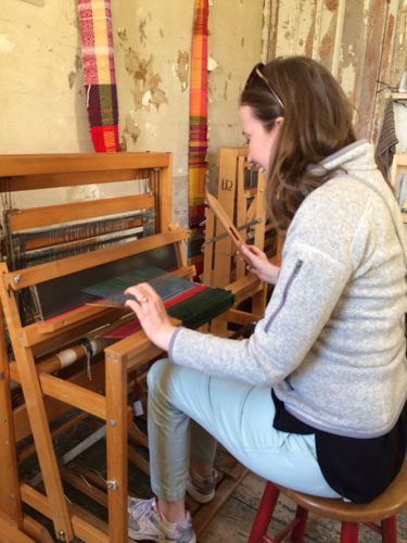 Sarah weaving at the Cotton Tenant House at Strawberry Banke