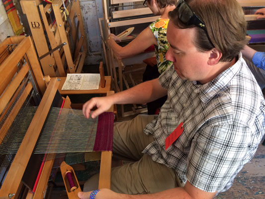 Glenn trying out the floor loom at Strawberry Banke in Portsmouth NH
